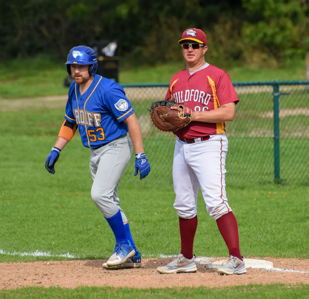 A Guildford fielder at a base during the 2025 play-off against Cardiff